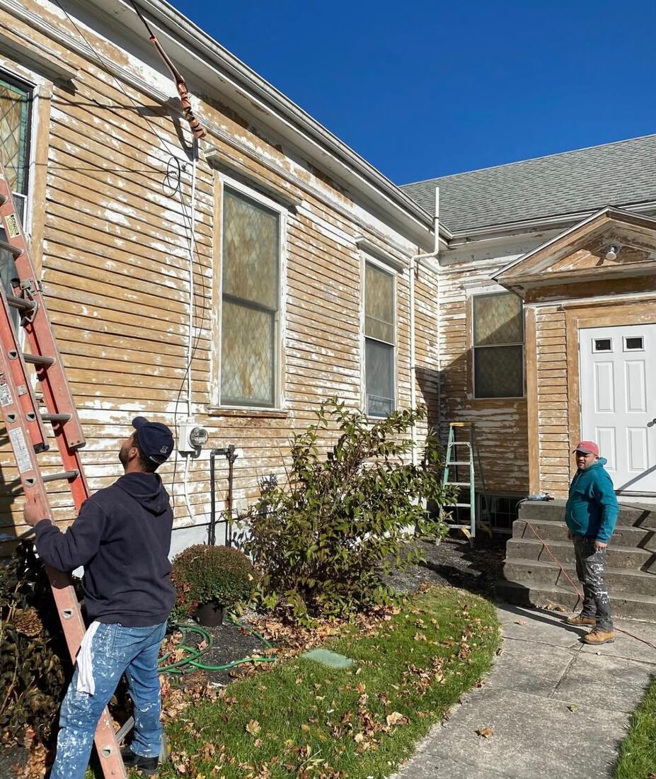 Marotta Painting crew painting a Cape Cod home exterior