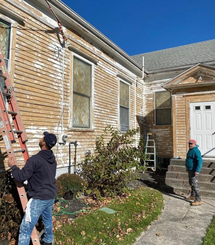 Marotta Painting crew painting a Cape Cod home exterior